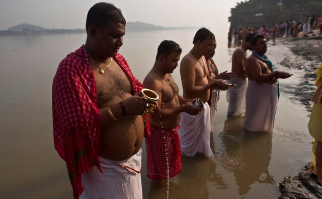 Hindu devotees perform rituals in the river Brahmaputra on the day of Mahalaya in Gauhati, Assam on Monday 8 October, 2018. Mahalaya is the day on which Hindus perform rituals and offer prayers in remembrance of their ancestors. The Associated Press/ Anupam Nath Hindu devotees perform rituals in the river Brahmaputra on the day of Mahalaya in Gauhati, Assam on Monday 8 October, 2018. Mahalaya is the day on which Hindus perform rituals and offer prayers in remembrance of their ancestors. The Associated Press/ Anupam Nath